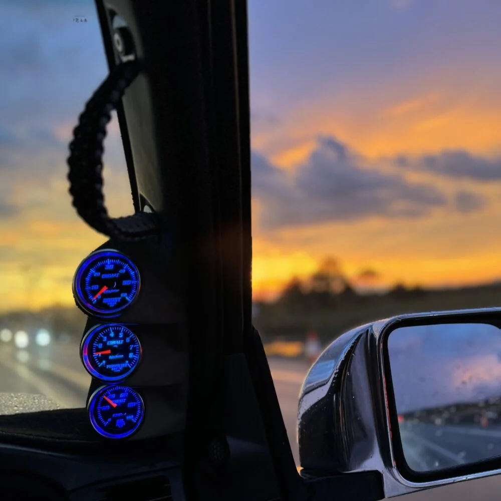 Kenay gauge mounts inside a vehicle at sunset